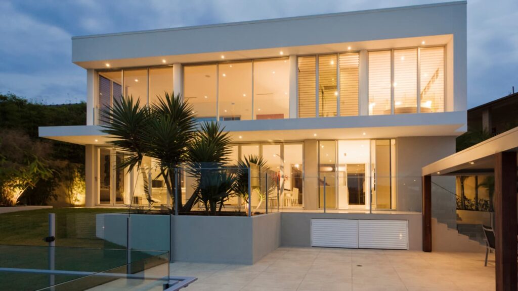 A modern home with a flat roof and internal gutter system