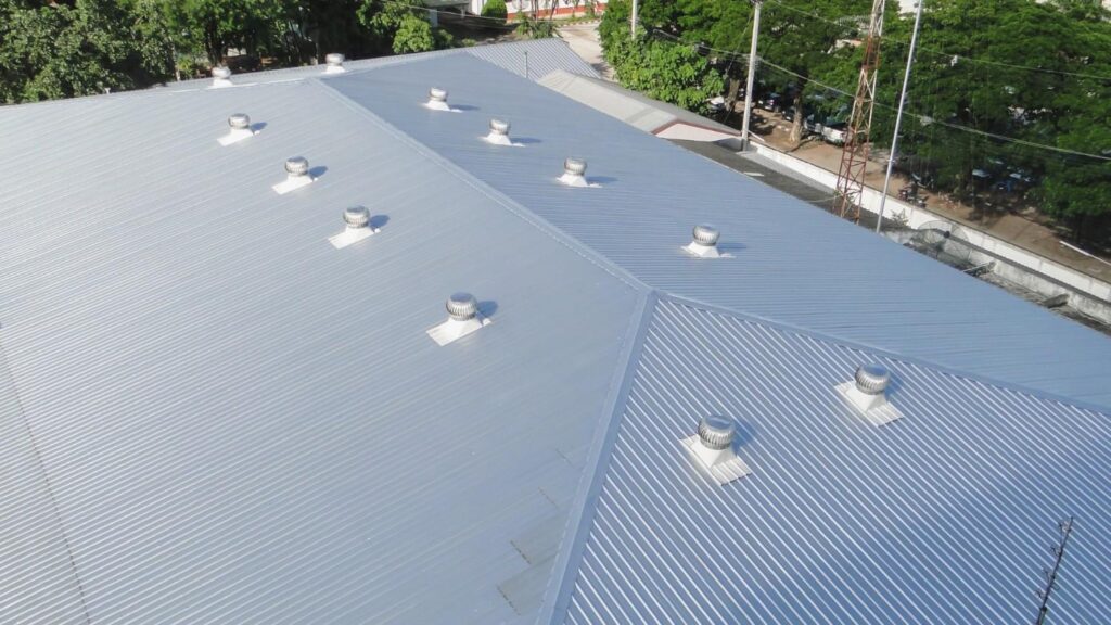 A very large commercial roof with metal roofing materials.