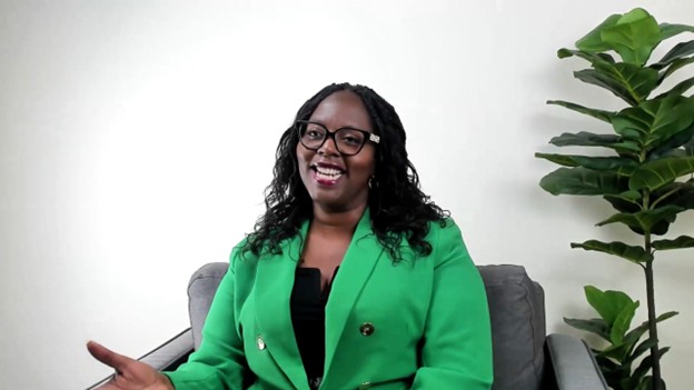 CEO Letitia Hanke smiles while speaking during an interview.